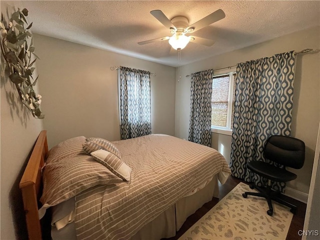 34 Salmon Meadow Ln, Richland, NY 13142 - bedroom with a textured ceiling, wood finished floors, and a ceiling fan