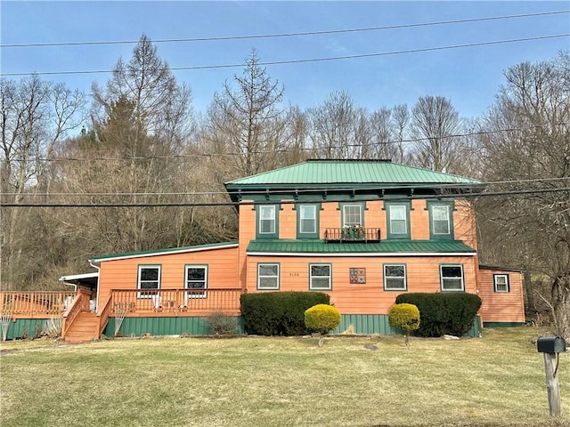 5166 State Highway 41, Smithville, NY 13778 - view of front of property with a front lawn, metal roof, a wooden deck, and a standing seam roof
