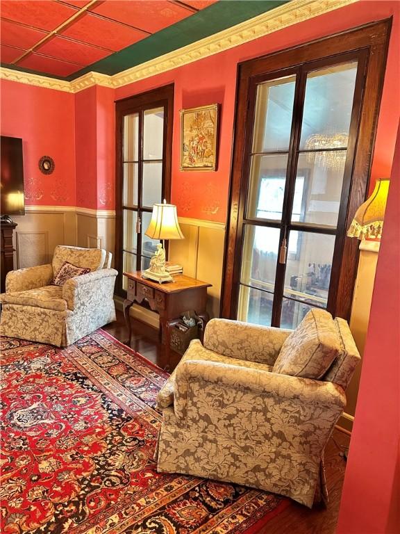 5166 State Highway 41, Smithville, NY 13778 - sitting room featuring a wainscoted wall and wood finished floors