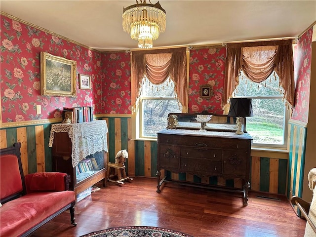 5166 State Highway 41, Smithville, NY 13778 - sitting room featuring wallpapered walls, a notable chandelier, and wood finished floors