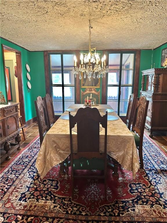 5166 State Highway 41, Smithville, NY 13778 - dining room with a textured ceiling, tile patterned flooring, baseboards, and a chandelier