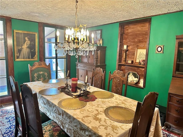 5166 State Highway 41, Smithville, NY 13778 - dining area featuring a textured ceiling and a chandelier