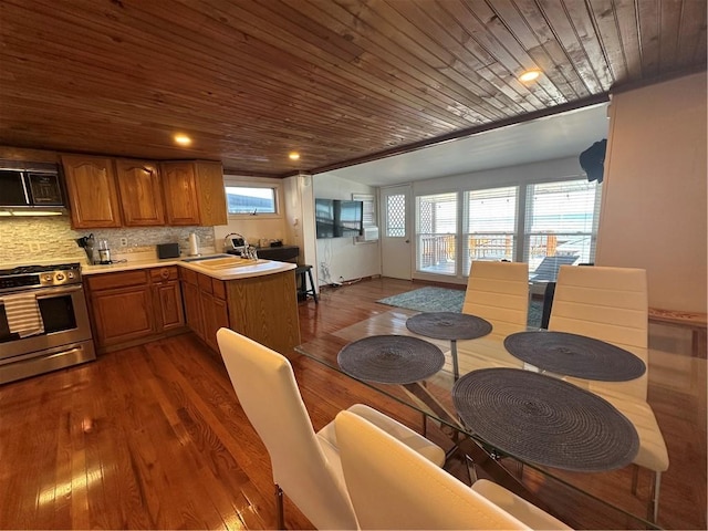dining area featuring wooden ceiling and dark wood-style floors