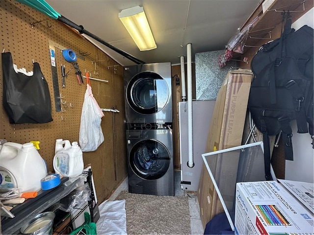 laundry area with stacked washer and dryer and laundry area