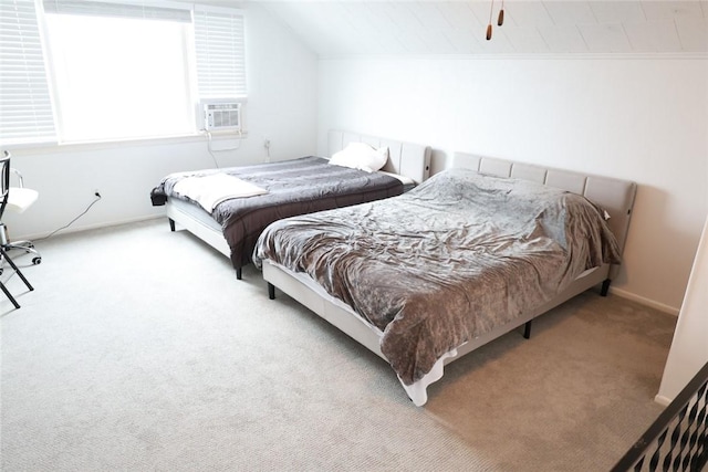 carpeted bedroom featuring cooling unit, baseboards, and lofted ceiling