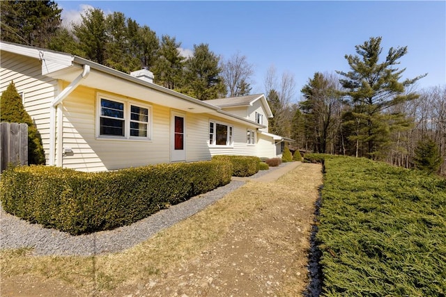 view of home's exterior with a chimney