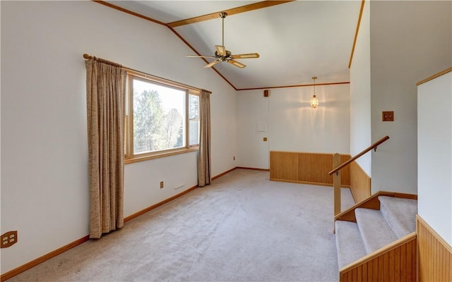 unfurnished room featuring baseboards, lofted ceiling, ceiling fan, and carpet