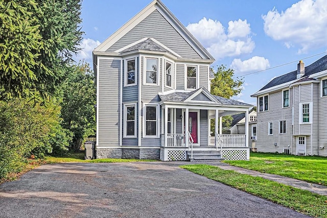 1002 N Madison St, Rome-Inside, NY 13440 - view of front of property with a front yard and covered porch