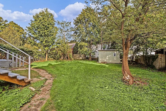 1002 N Madison St, Rome-Inside, NY 13440 - view of yard featuring an outbuilding, a storage unit, and a fenced backyard