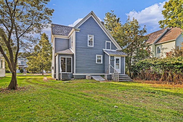 1002 N Madison St, Rome-Inside, NY 13440 - rear view of house featuring a lawn, entry steps, and roof with shingles