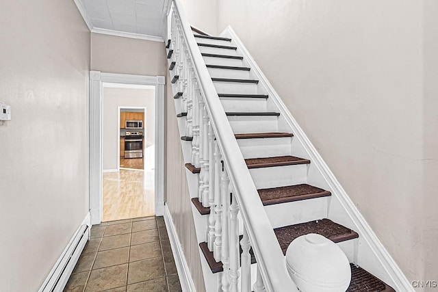 1002 N Madison St, Rome-Inside, NY 13440 - stairway with tile patterned floors, crown molding, and a baseboard heating unit