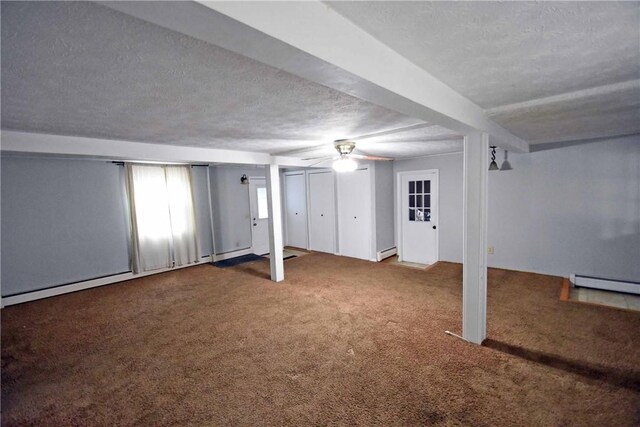21 Algonquin Dr, Big Flats, NY 14845 - below grade area with a textured ceiling, carpet floors, a baseboard radiator, and a ceiling fan