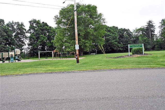 21 Algonquin Dr, Big Flats, NY 14845 - surrounding community with a lawn and view of scattered trees