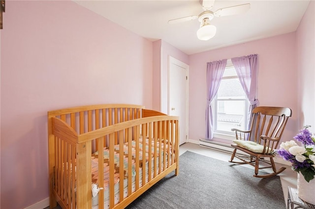 carpeted bedroom featuring baseboards and ceiling fan