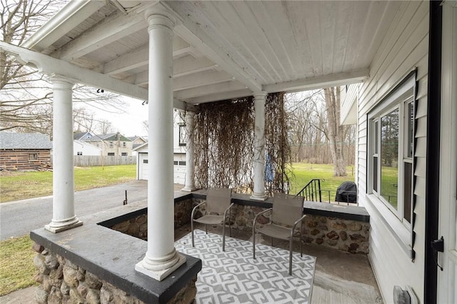view of patio with an outbuilding