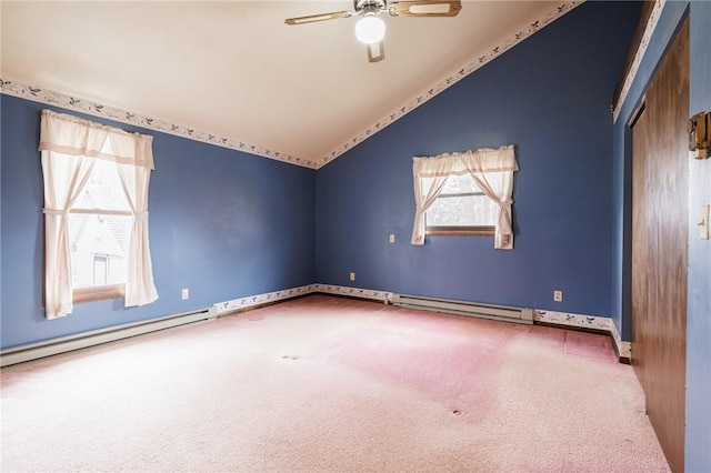carpeted empty room with baseboards, lofted ceiling, ceiling fan, and a baseboard radiator