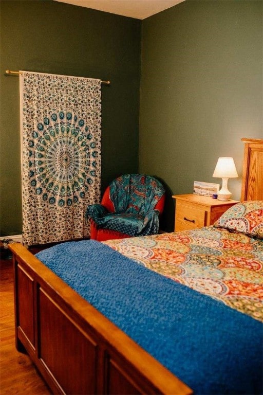 bedroom featuring wood finished floors