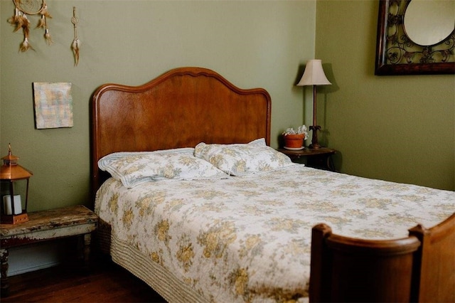 bedroom featuring dark wood-style floors
