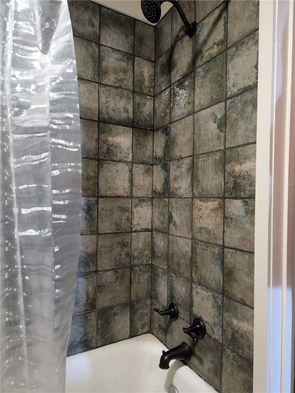 full bath with shower / bath combination with curtain