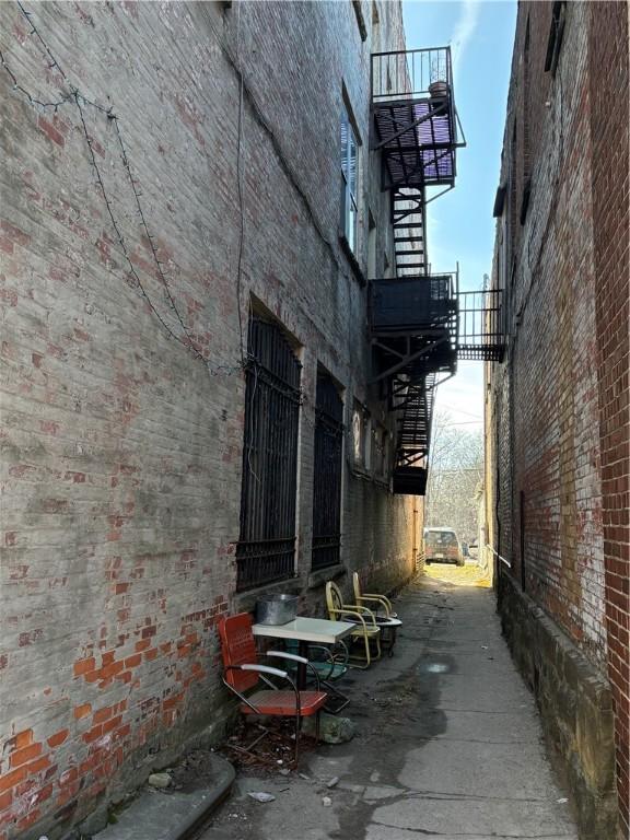 view of side of property with brick siding