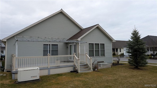view of front of home with a wooden deck and a front lawn
