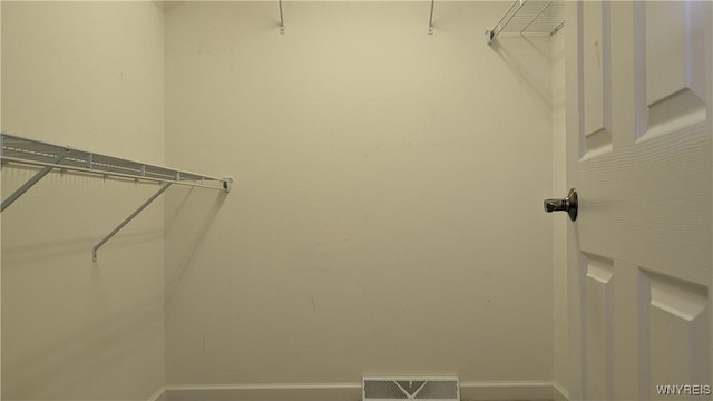 walk in closet with visible vents