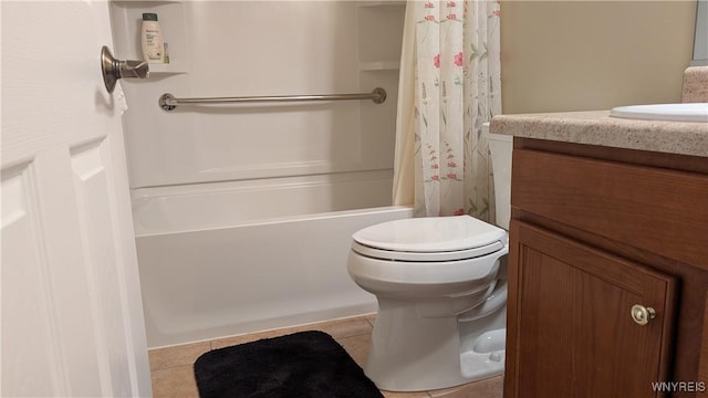 bathroom with tile patterned floors, vanity, toilet, and shower / bath combo