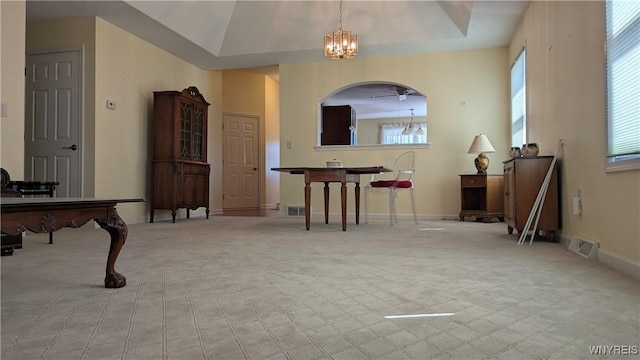interior space with an inviting chandelier, plenty of natural light, carpet floors, and visible vents