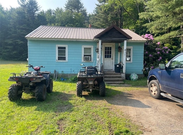 411 Emmonsburg Rd, Salisbury, NY 13454 - bungalow-style home with a front yard and a metal roof