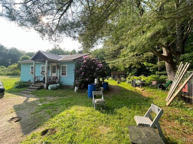 411 Emmonsburg Rd, Salisbury, NY 13454 - view of side of home with a metal roof and covered porch
