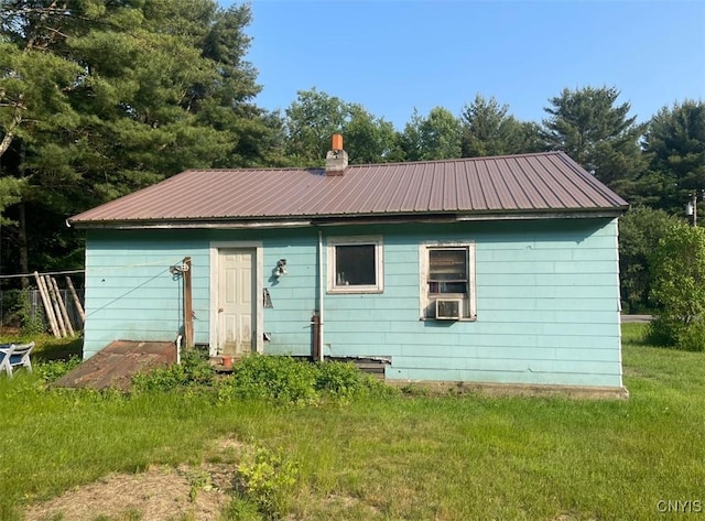 411 Emmonsburg Rd, Salisbury, NY 13454 - rear view of house with a metal roof and a lawn