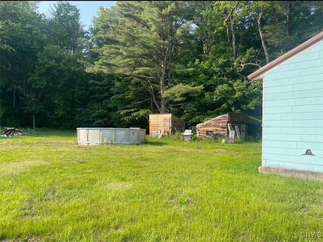 411 Emmonsburg Rd, Salisbury, NY 13454 - view of grassy yard with an outdoor pool