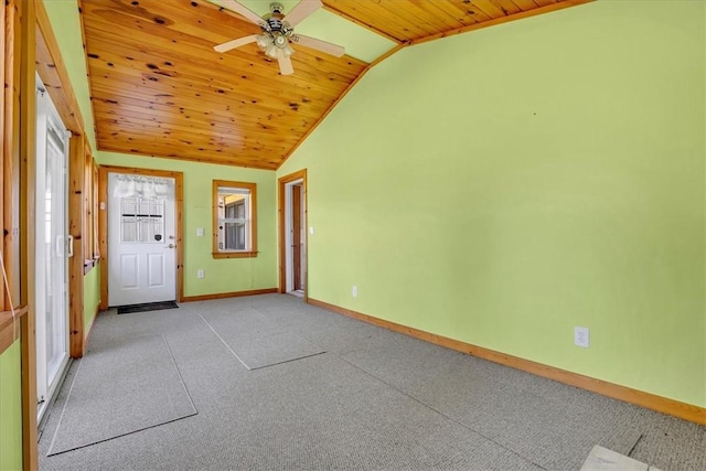 interior space with carpet, baseboards, ceiling fan, lofted ceiling, and wood ceiling