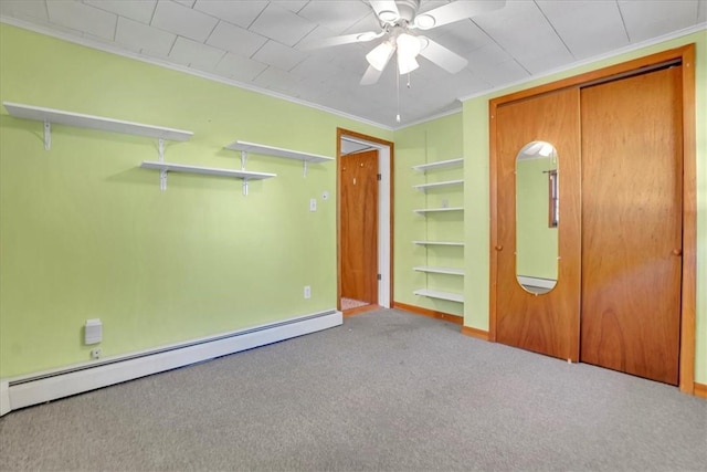 unfurnished bedroom featuring ornamental molding, carpet, baseboards, a closet, and baseboard heating