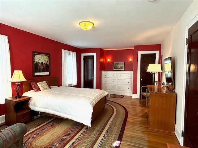 bedroom with wood finished floors