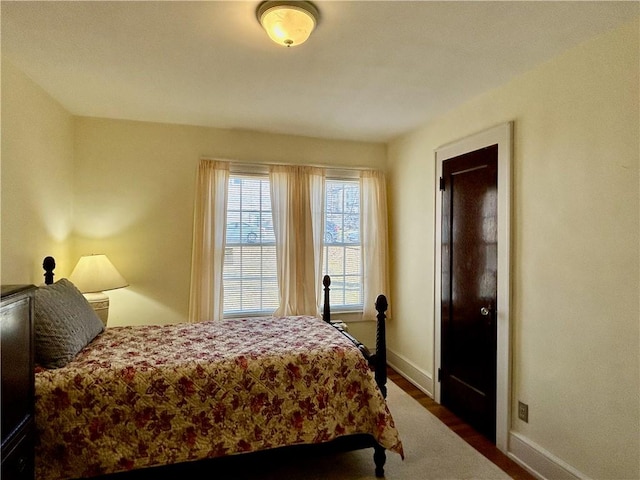 bedroom featuring baseboards