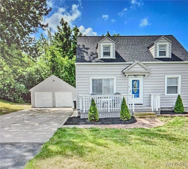 cape cod-style house featuring a front yard, a porch, an outbuilding, and a garage