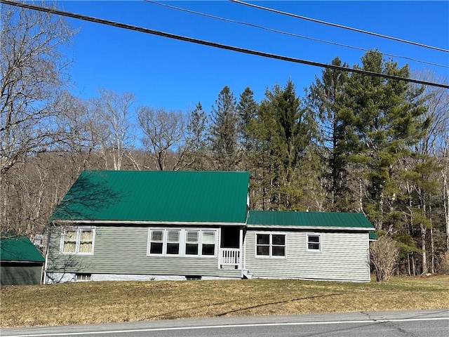 5187 State Highway 23, Norwich-Town, NY 13815 - view of front of house featuring a front lawn and metal roof