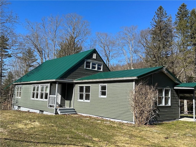 5187 State Highway 23, Norwich-Town, NY 13815 - view of front of property with metal roof, a front yard, and a carport