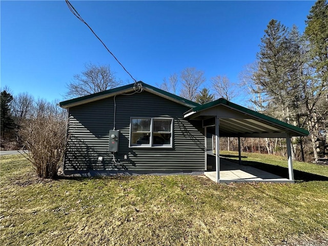 5187 State Highway 23, Norwich-Town, NY 13815 - view of side of property featuring a carport and a yard