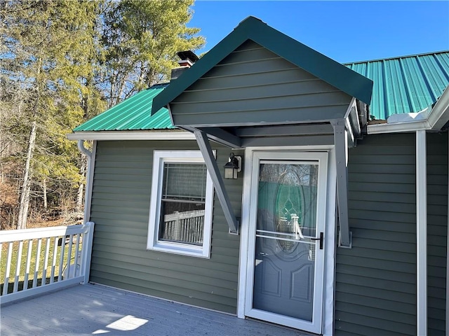 5187 State Highway 23, Norwich-Town, NY 13815 - property entrance featuring a chimney, a deck, and metal roof