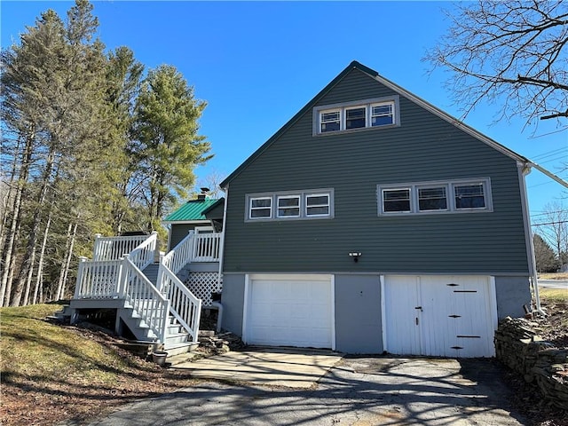 5187 State Highway 23, Norwich-Town, NY 13815 - exterior space with driveway, a garage, stairs, and a wooden deck