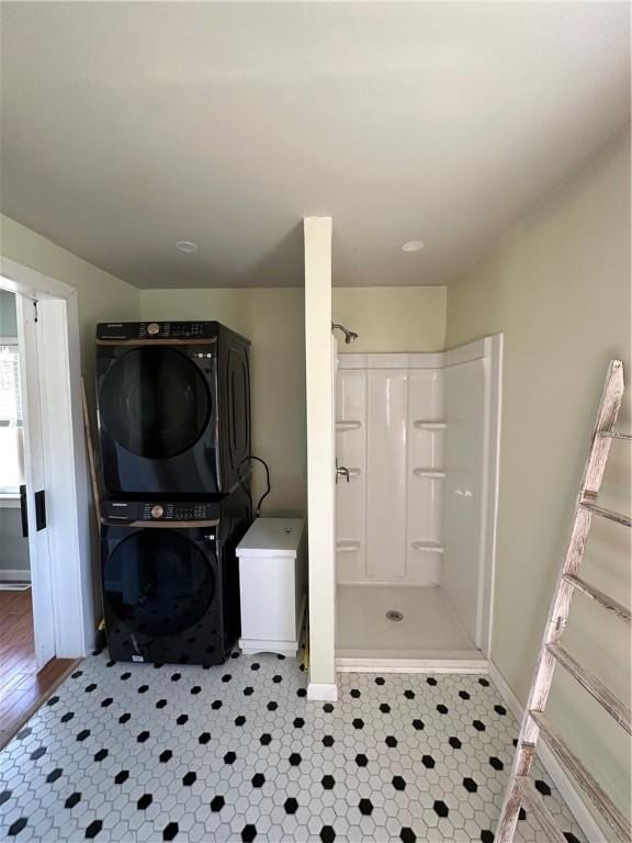 5187 State Highway 23, Norwich-Town, NY 13815 - laundry room with baseboards, stacked washer / drying machine, and laundry area