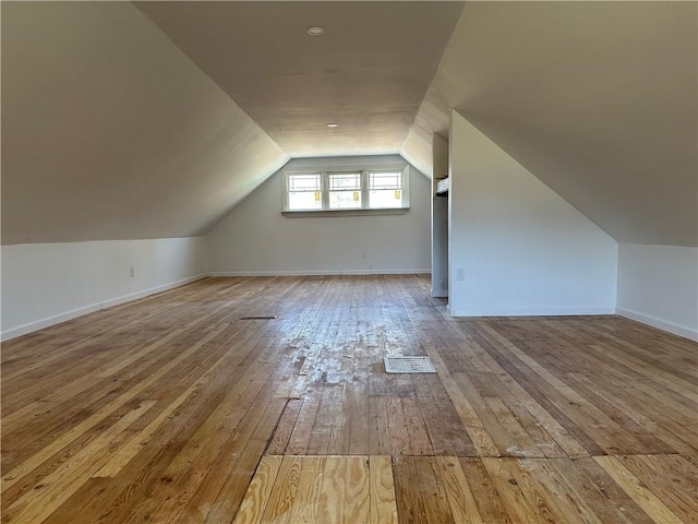 5187 State Highway 23, Norwich-Town, NY 13815 - bonus room with baseboards, lofted ceiling, visible vents, and wood-type flooring
