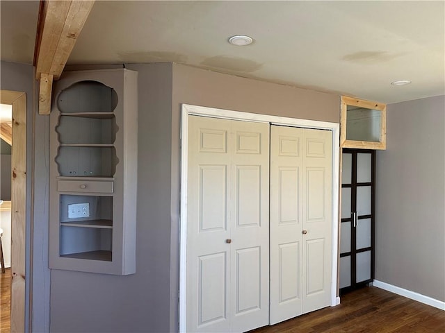 5187 State Highway 23, Norwich-Town, NY 13815 - unfurnished bedroom with dark wood finished floors, baseboards, and a closet