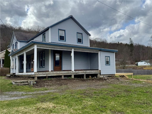 59 State Route 200, Harford, NY 13835 - view of front of house featuring a porch, fence, and a front lawn