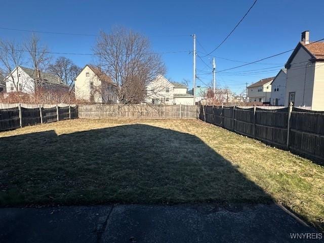 view of yard with a fenced backyard