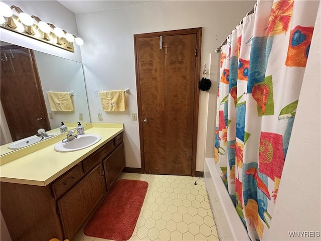 bathroom featuring vanity and shower / tub combo
