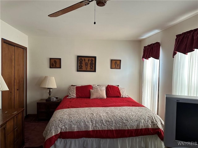 bedroom featuring a ceiling fan and a closet