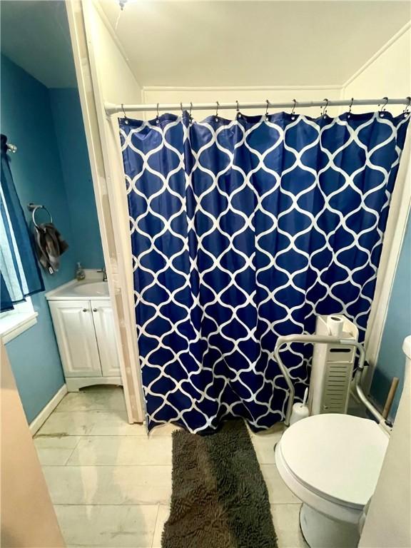 1842 E Lake Rd, Spafford, NY 13152 - full bathroom featuring toilet and curtained shower